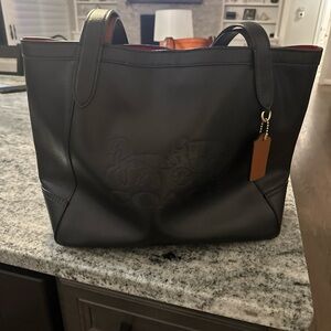 Large coach horse and carriage bag. 
Black